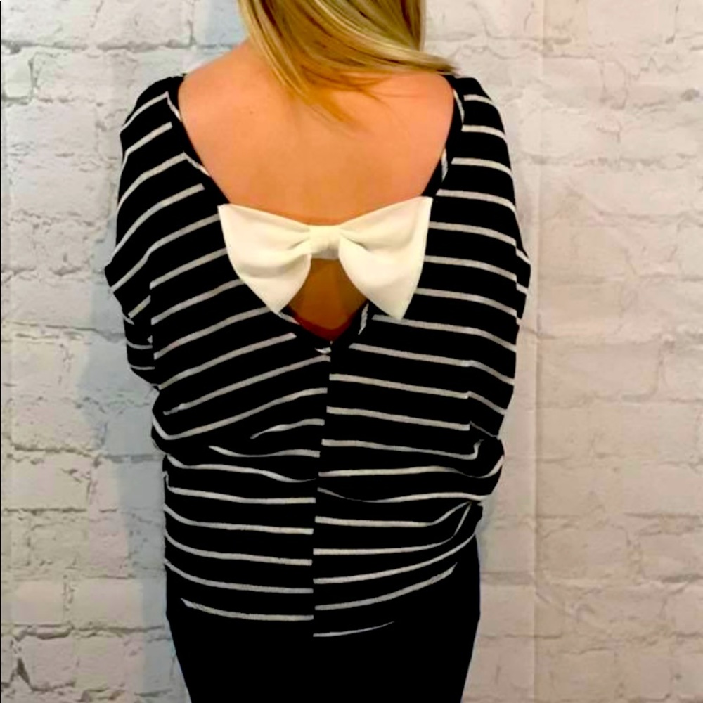 New striped Boutique sweater with a darling white bow on the back.